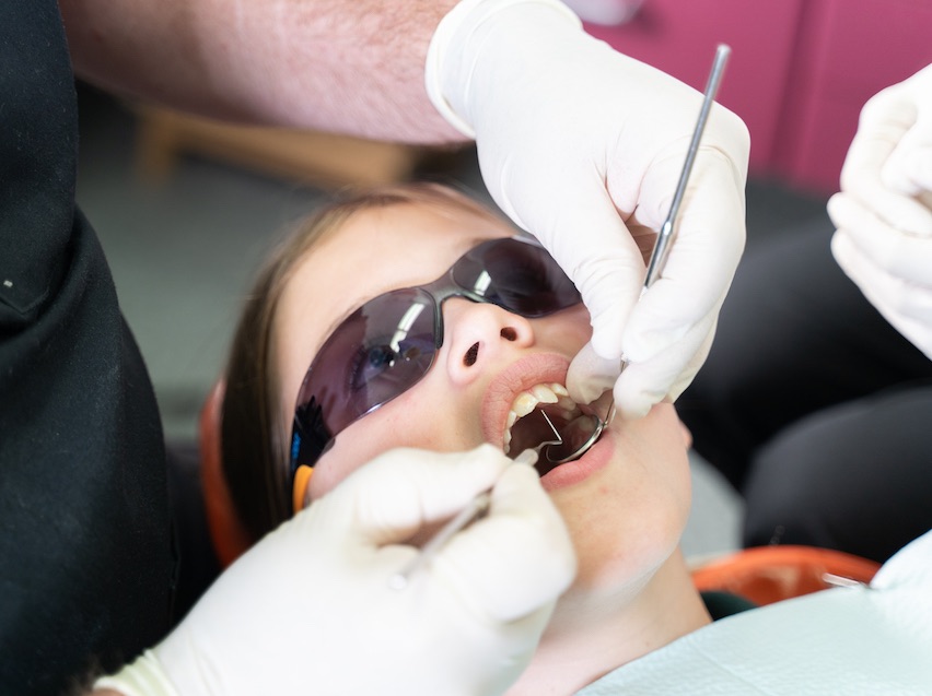 Child having their teeth examined at the dentist