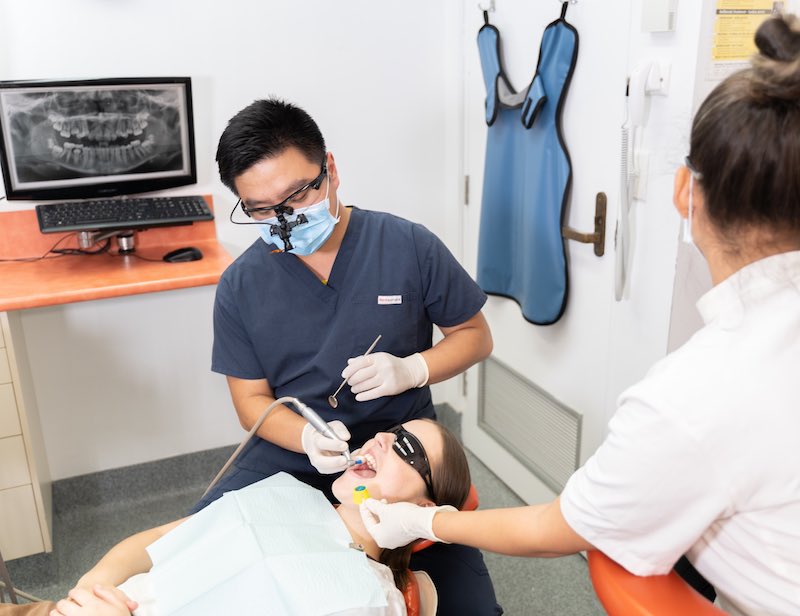 Jacky Yu treating a patient in the Toowong dental clinic